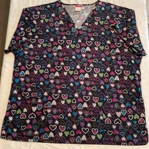 Dickies women’s scrubs top, XL, hearts on black background. Like new.